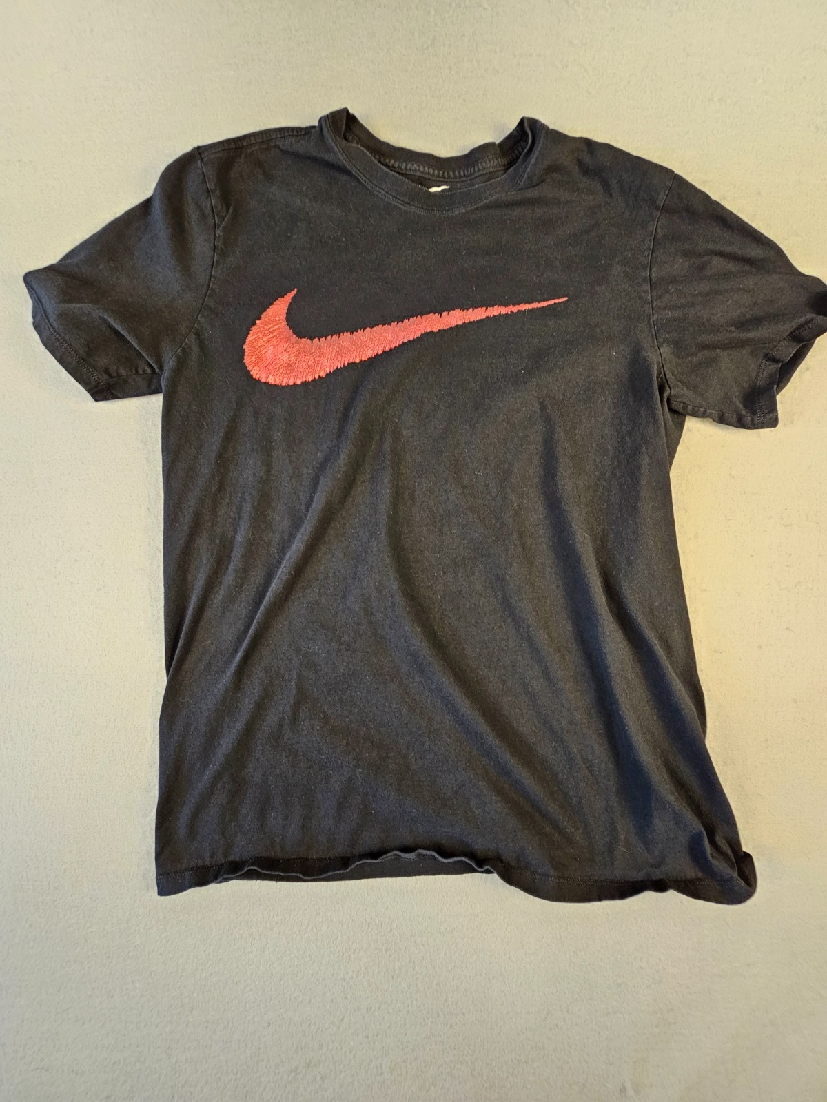 Nike Size L Men’s Black T-Shirt with Red Swoosh.